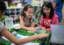 Two students using Sphero BOLT coding robot for kids in the classroom.