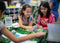 Two students using Sphero BOLT coding robot for kids in the classroom.